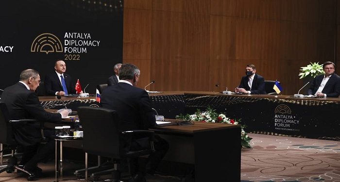 In this photo provided by Turkish Foreign Ministry, Turkish Foreign Minister Mevlut Cavusoglu, top left, chairs a tripartite meeting with Russia's Foreign Minister Sergey Lavrov, left, and Ukraine's Foreign Minister Dmytro Kuleba, right, in Antalya, Turkey, Thursday, March 10, 2022. (Cem Ozdel/Turkish Foreign Ministry via AP)