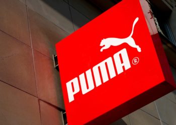FILE PHOTO: The logo of German sports goods firm Puma is seen at the entrance of one of its stores in Vienna, Austria, March 18, 2016.   REUTERS/Leonhard Foeger/File Photo