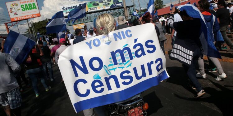 A demonstrator holds a banner reading "No more censorship" during a protest against police violence and the government of Nicaraguan President Daniel Ortega in Managua, Nicaragua April 23, 2018. REUTERS/Oswaldo Rivas