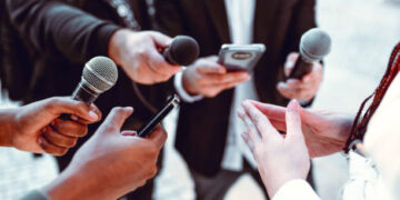 Female Leading Interview With Journalists Outside