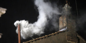 White smoke emerges from the chimney on the roof of the Sistine Chapel, in St. Peter's Square at the Vatican, Wednesday, March 13, 2013. The white smoke indicates that the new pope has been elected. (Photo by Gregorio Borgia/AP Photo)